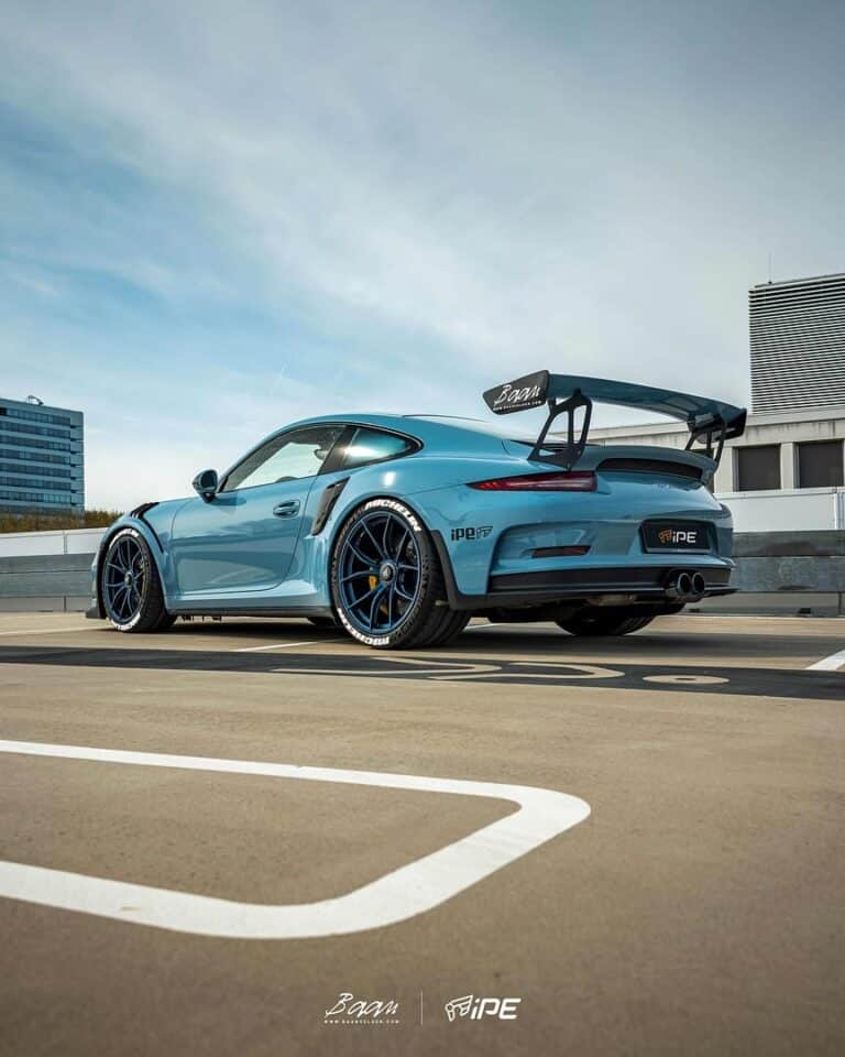 Blue Porsche 911 on aftermarket wheels