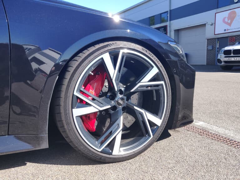 Close-up of an alloy wheel and brake