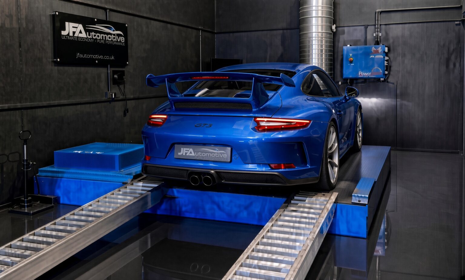 Blue Porsche 911 GT3 on the rolling road at JF Automotive